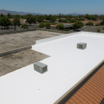 My commercial roof is showing wear — should I repair it or just replace the whole thing?
